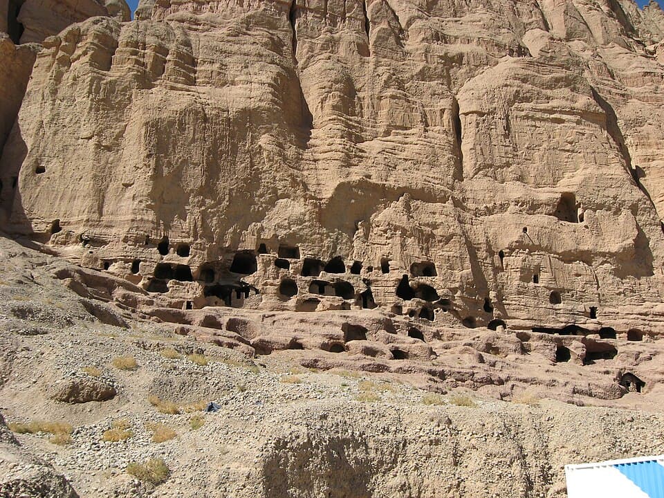 Rock-cut cave openings along the Bamiyan cliff