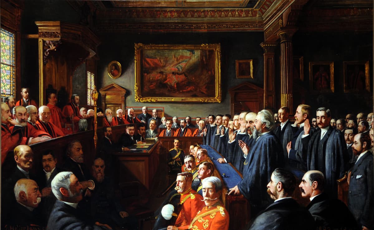 An 1893 painting of the Assize d'Heritage, which is a biannual convening of the Royal Court of Jersey, where the Seigneurs of the major fiefs answer for their fiefs, which they hold directly from the Crown. The painting was purchased by Julia Westaway and donated to the Royal Court, where it still hangs.