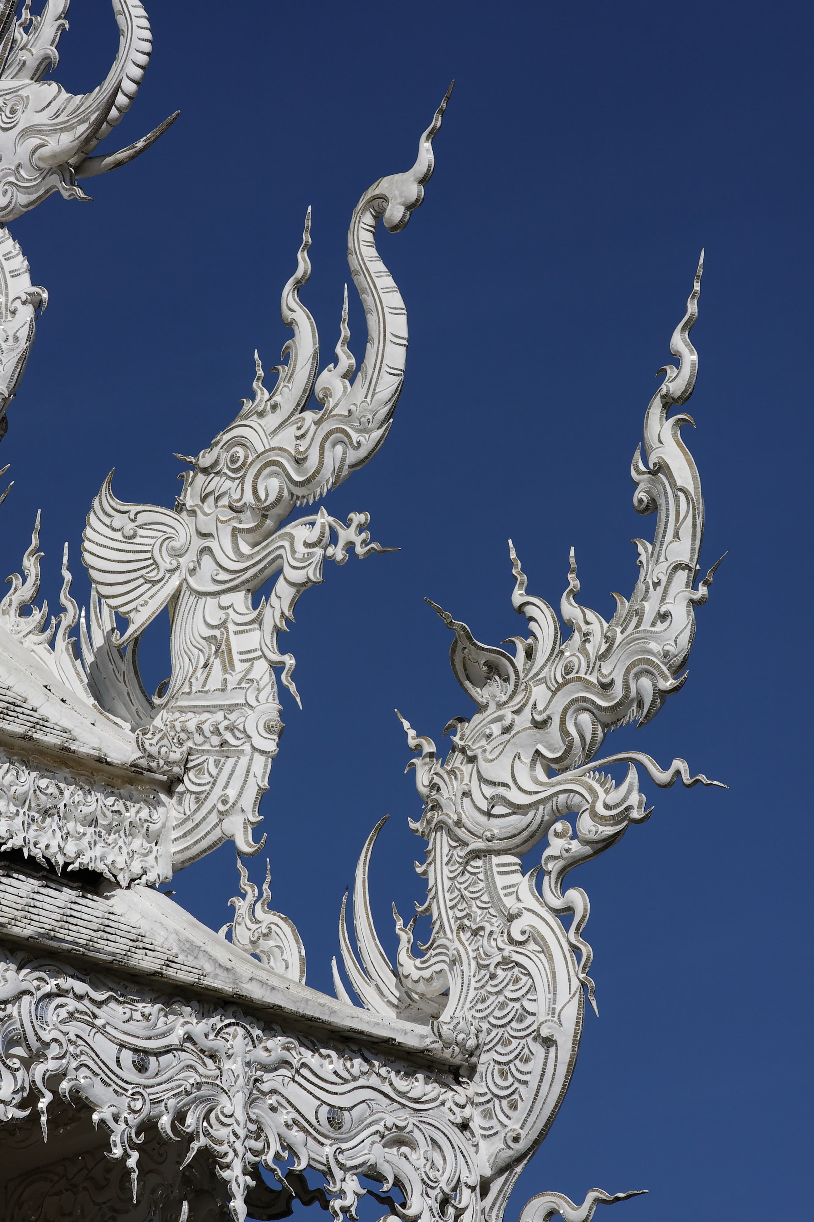 Ornamental chofa detail at Wat Rong Khun