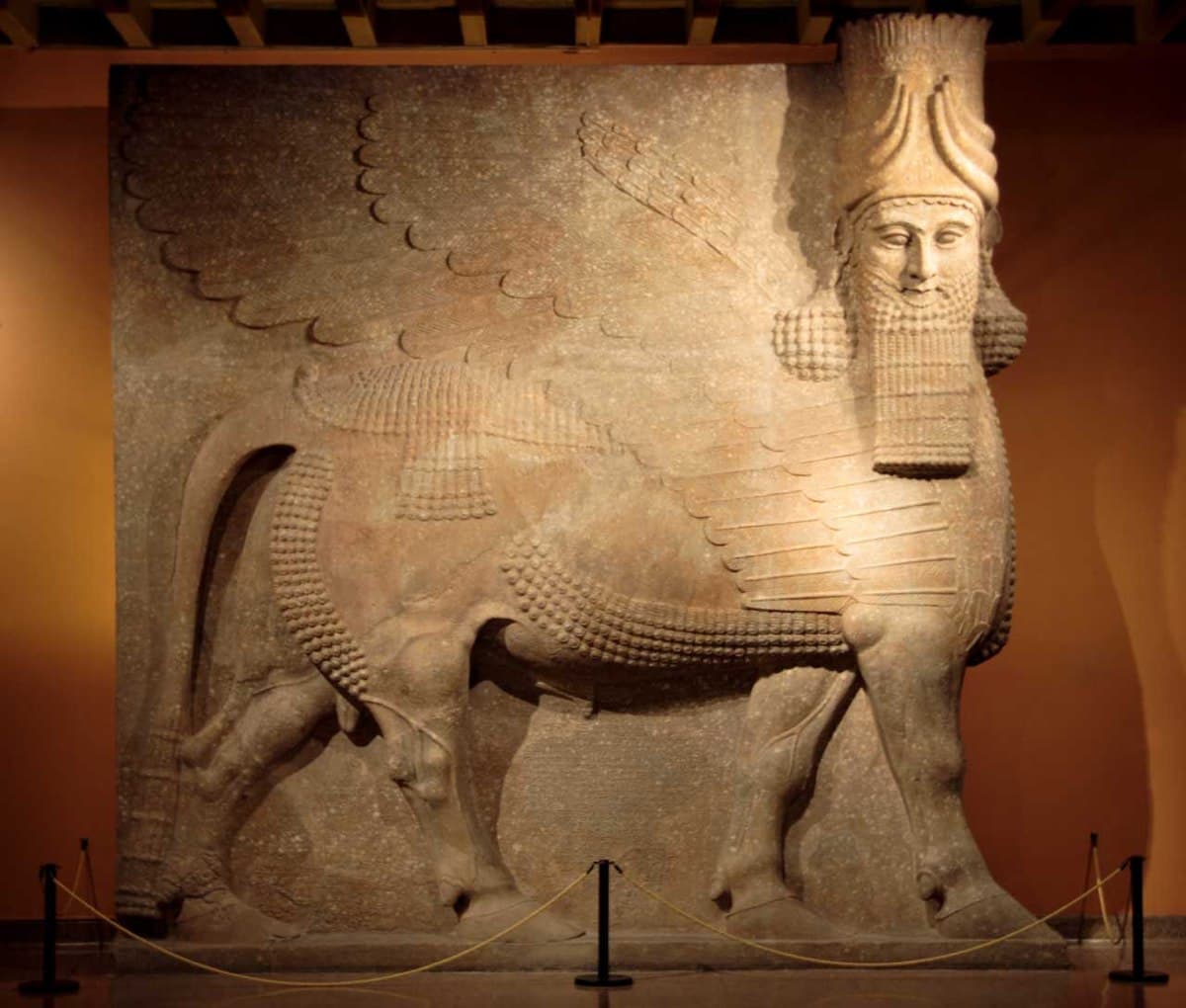 This is the  Assyrian Lamassu at the Oriental Institute Museum at the University of Chicago.
Gypsum (?) 
Khorsabad, entrance to the throne room 
Neo-Assyrian Period, 
ca. 721-705 B.C. 
OIM A7369
This 40 ton statue was one of a two flanking the entrance to the throne room of King Sargon II. A protective spirit known as a lamassu, it is shown as a composite being with he head of a human, the body and ears of a bull, and the wings of a bird. When viewed from the side, the creature appears to be wal