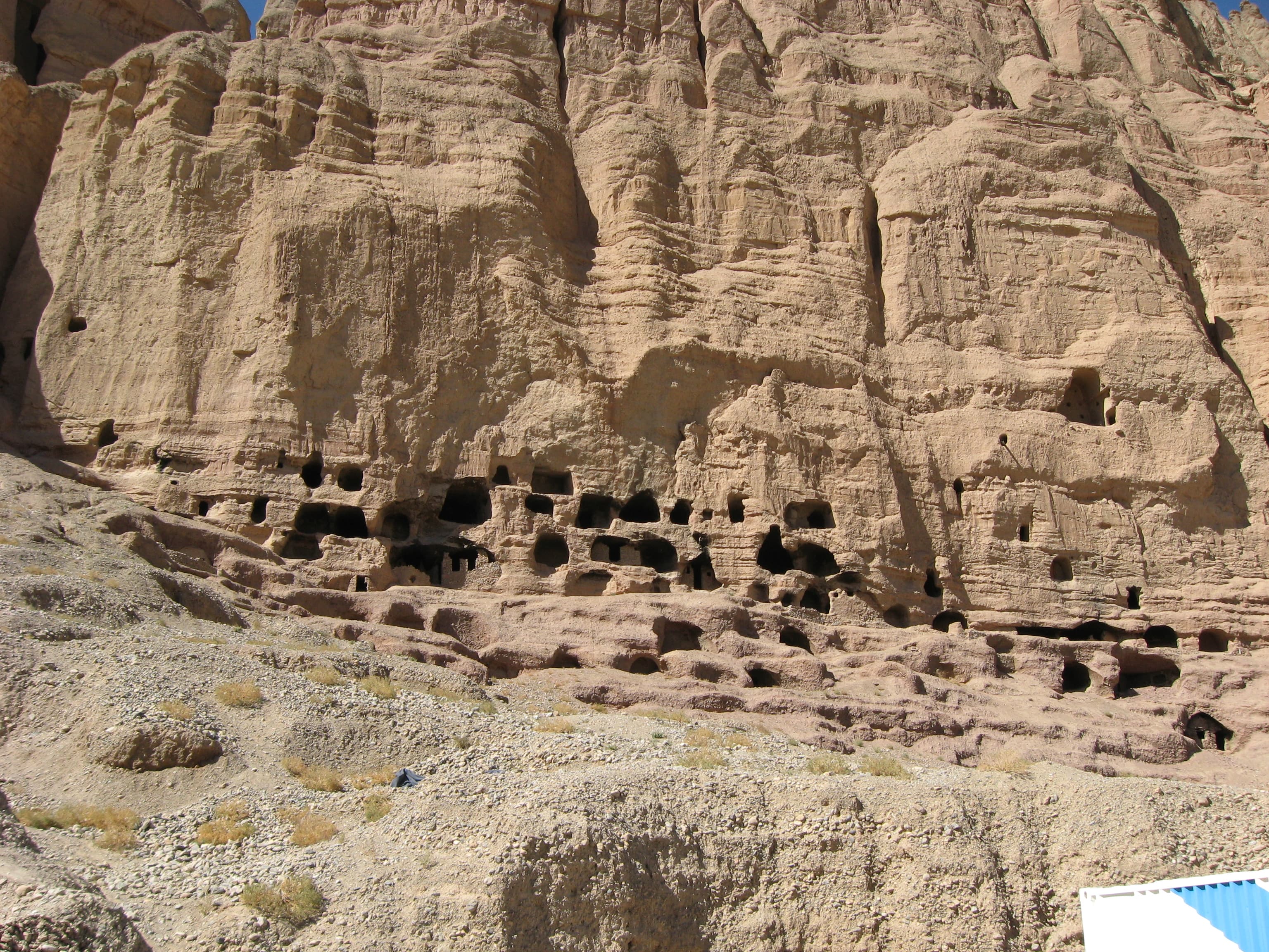 Rock-cut cave openings along the Bamiyan cliff