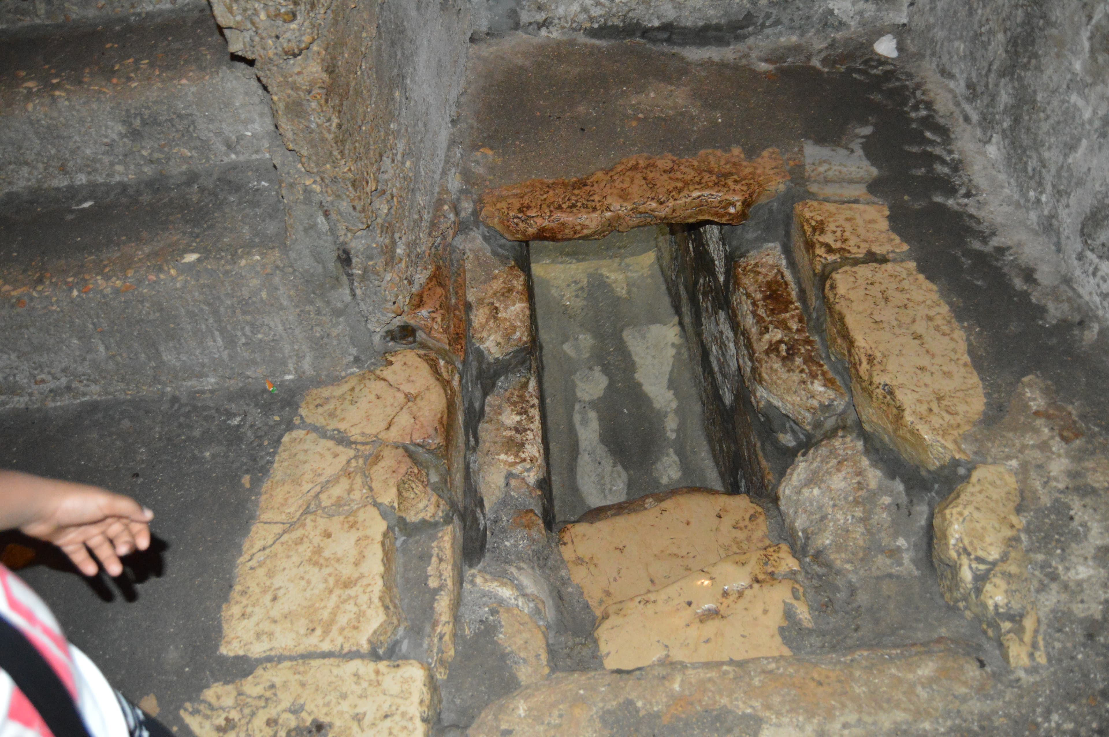 Low stone opening leading into the burial chamber at the Tomb of Lazarus in Bethany